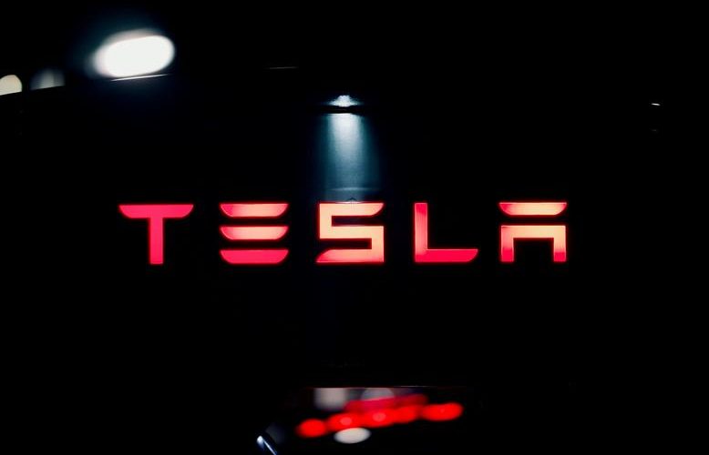 Tesla holds bitcoin steady, reports $112M impairment loss
